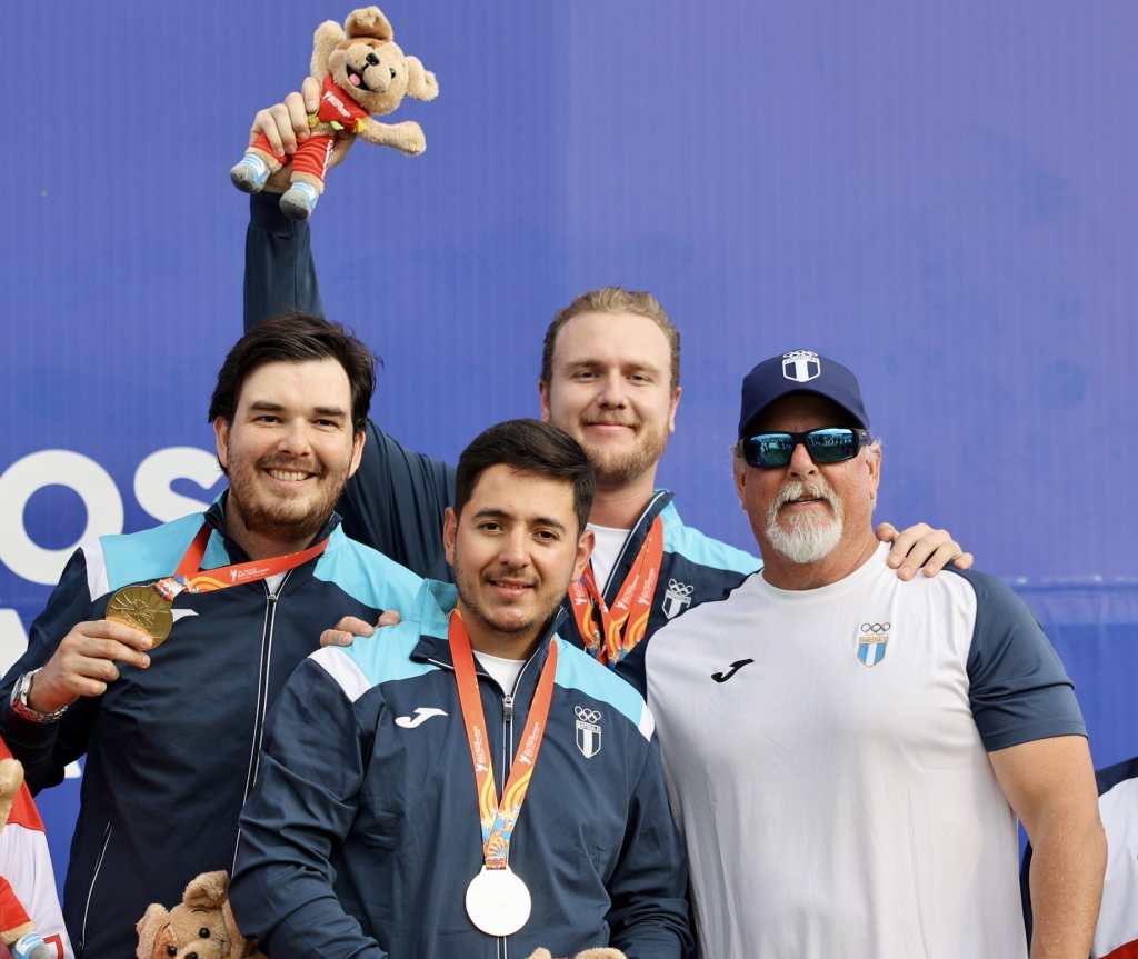 Guatemalan skeet team celebrating gold medal win.