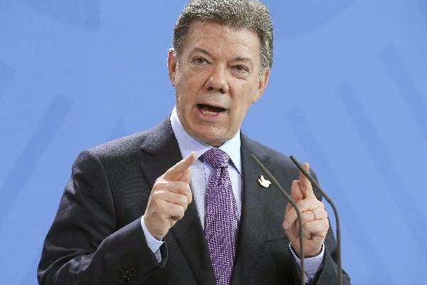 El presidente de Colombia, Juan Manuel Santos, confía que la firma de paz con los rebeldes colombianos coincida con el ingreso del país a la OCDE. (Foto Prensa Libre: EFE)