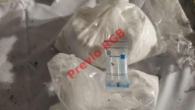 Herohina, cocaína y dólares fueron encontrados en laboratiorio clandestino en Masagua, Escuintla. (Foto Prensa Libre: Carlos Paredes)