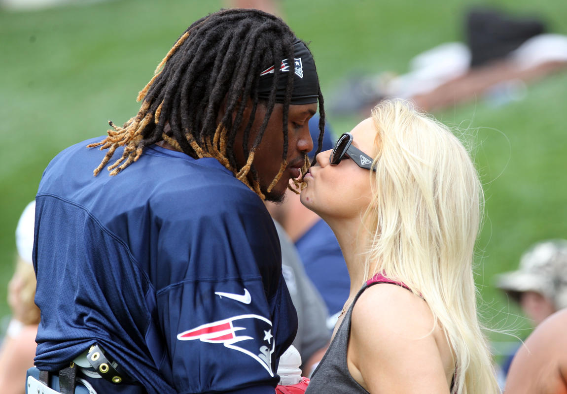 (Foxborough, MA, 07/30/15) New England Patriot linebacker Dont'a Hightower gets a kiss from girlfriend Morgan Hart after the first day of Patriots training camp at Gillette. Thursday, July 30, 2015. Staff photo by John Wilcox.