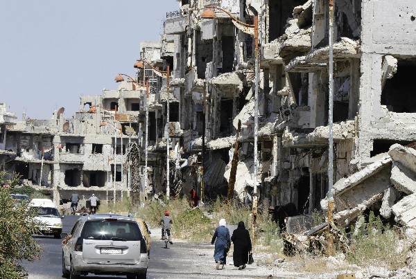 Varios edificios fueron destruidos por el régimen sirio en la ciudad de Homs. (Foto Prensa Libre: AFP)