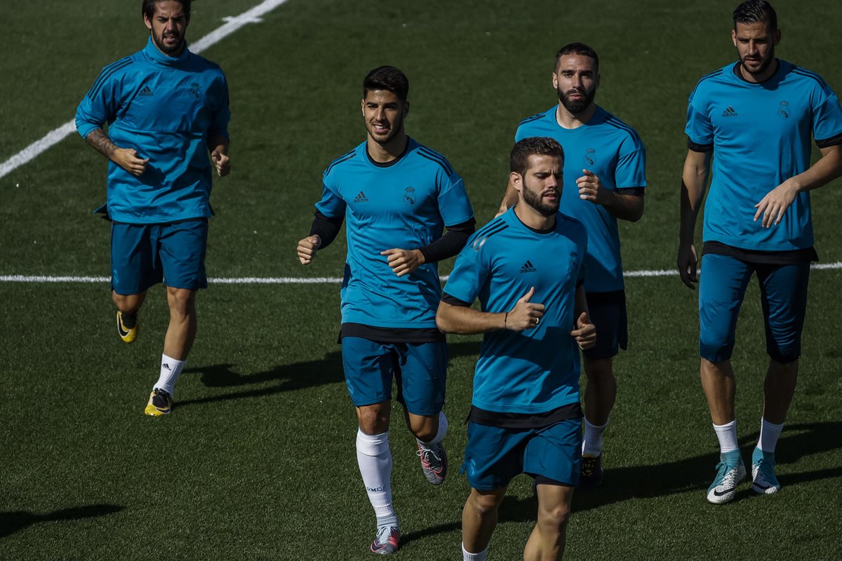 Marco Asensio entrenó ayer junto al resto de sus compañeros, pero quedó fuera de la convocatoria. (Foto Prensa Libre: EFE)