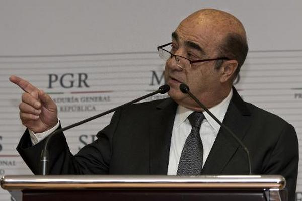 Jesús Murillo Karam habla sobre los 43 estudiantes desaparecidos, en  calidad de Fiscal General de México. (Foto Prensa Libre: AFP)