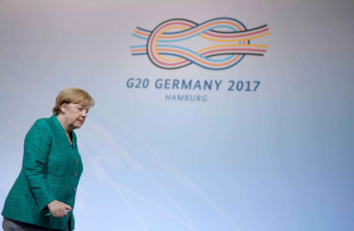 La anfitriona del G20, Ángela Merkel, dijo estar satisfecha por los acuerdos sobre comercio. (Foto Prensa Libre: EFE)