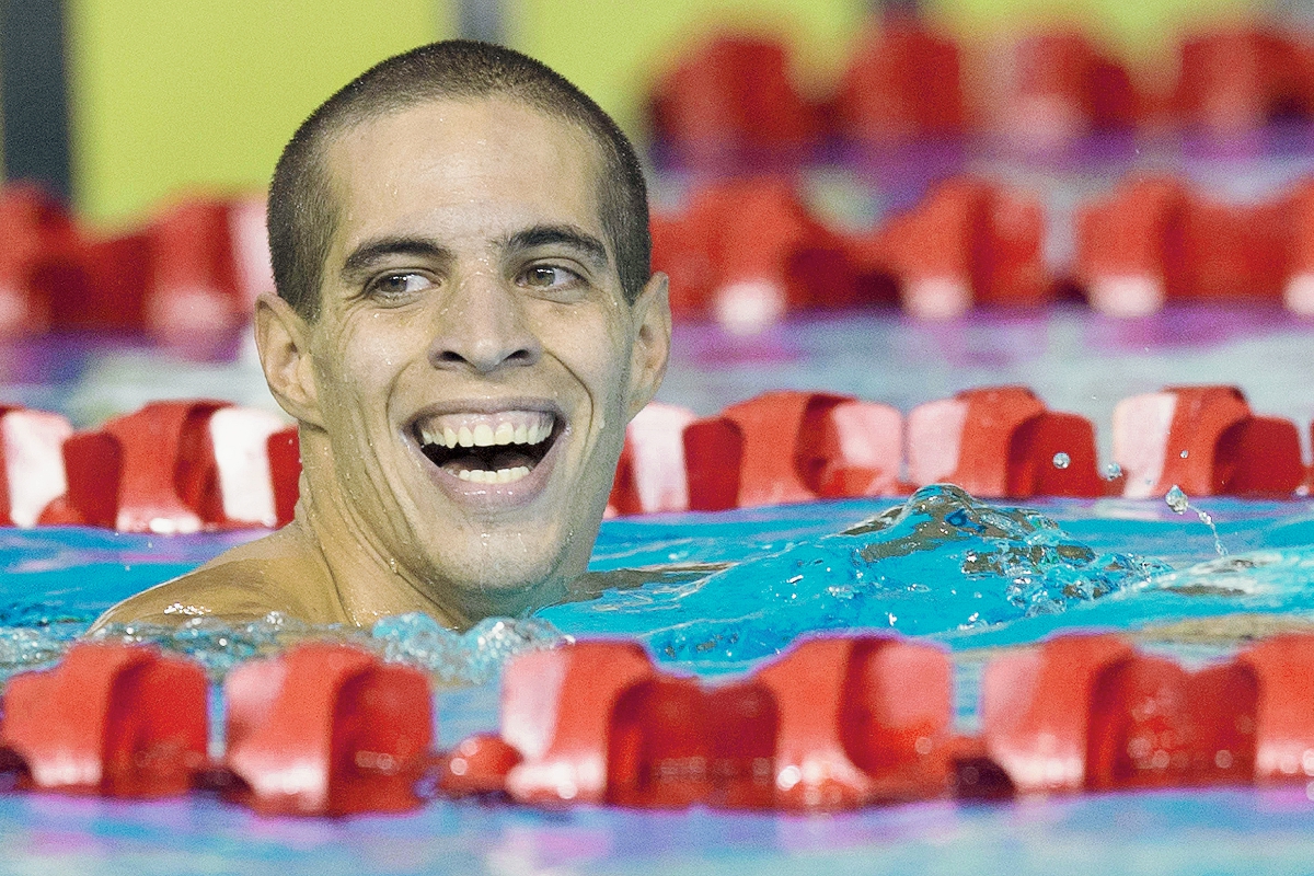 El nadador peruano, Mauricio Fiol of Peru sonrie durante las competencias de los 200 metros. (Foto Prensa Libre: AFP)