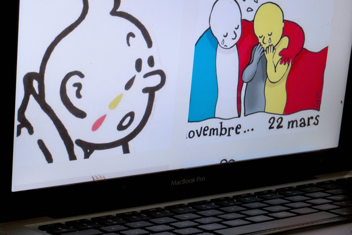 La imagen de las lágrimas del cómic "Tintín" también se multiplican en las calles de Bruselas. (Foto Prensa Libre: AFP).