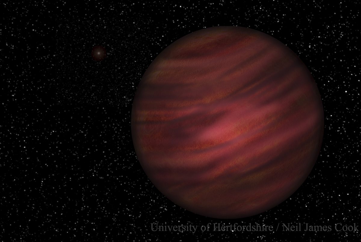 Representación del planeta gigante de gas 2MASS J2126-8140 en la órbita alrededor de la estrella enana roja TYC 9486-927-1, ligeramente visible en el fondo. (Foto Prensa Libre: EFE).