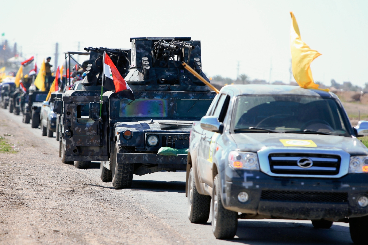 Integrantes de las fuerzas de seguridad de Iraq salen de la ciudad de Samarra en el norte de Bagdad. Foto Prensa Libre: AFP)