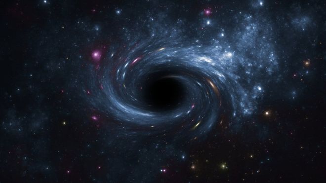 Recreación de un agujero negro rodeado de astros luminosos. GETTY IMAGES