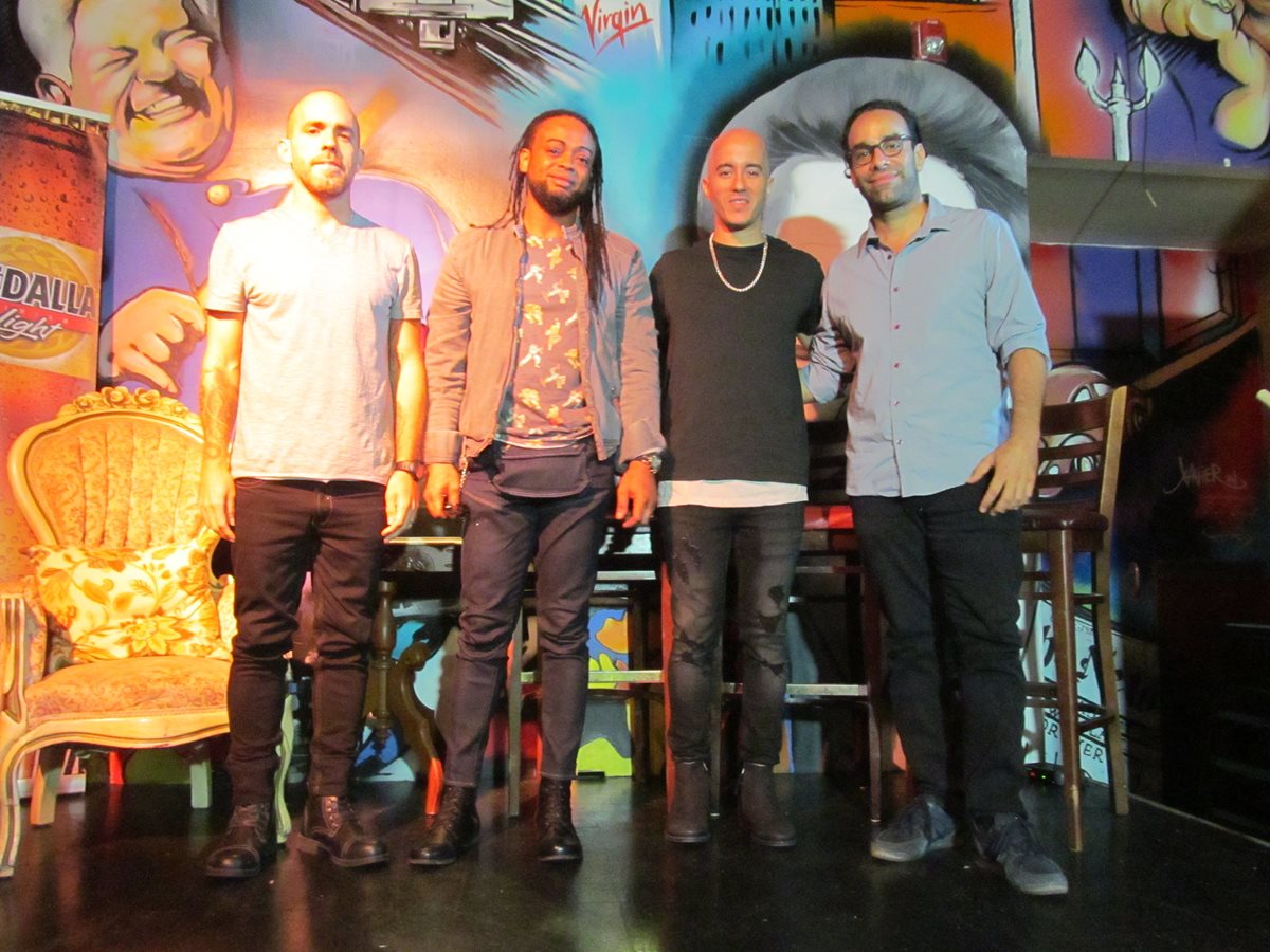 Los integrantes del grupo Cultura Profética, (de izq. a dcha.) Eliut González (guitarra), Boris Bilbraut (batería), Willy Rodríguez (cantante principal y bajista) y Omar Silva (guitarra y bajo) posan al final de una conferencia de prensa celebrada el miércoles en San Juan, Puerto Rico. (Foto Prensa Libre: EFE).