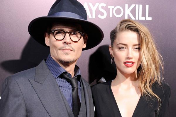Johnny Depp y Amber Heard durante el estreno en EE. UU. del filme 3 días para matar, en febrero del 2014. (Foto Prensa Libre: AFP)