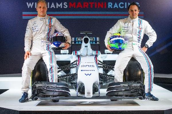 Felipe Massa y Valtteri Bottas posan junto al nuevo monoplaza FW36 de la escudería Williams. (Foto Prensa Libre: AP)