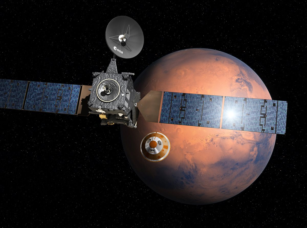Representación artística del momento en que Mars Express se despega del módulo para aterrizar en Marte. (Foto Prensa Libre: AFP).
