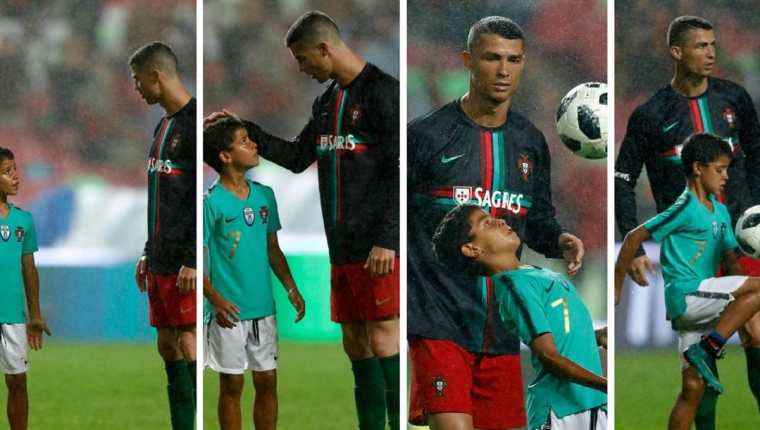 Cristiano Ronaldo y su hijo conversan sobre la gramilla del Estadio Da Luz, en Lisboa, luego del triunfo de Portual 3-0 sobre Algeria. (Foto Prensa Libre: EFE)