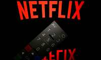 (FILES)This illustration picture taken on April 21, 2018 in Paris shows the logo of the Netflix entertainment company, displayed on a tablet screen with a remote control in front of it. - By earning its first-ever Oscar nomination for best picture with "Roma," Netflix has propelled itself into Hollywood's club of elite filmmakers, but the streaming giant's hybrid business model still hasn't won over its sharpest critics. Netflix on January 22, 2019 earned a whopping 10 nominations for Alfonso Cuaron's cinematic love letter to his childhood in Mexico City, three more for "The Ballad of Buster Scruggs" and two for documentary shorts. (Photo by Lionel BONAVENTURE / AFP)
