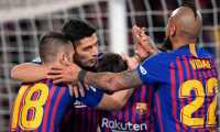 Barcelona's Uruguayan forward Luis Suarez (2L) celebrates with teammates after scoring during the Spanish Copa del Rey (King's Cup) quarter-final second leg football match between Barcelona and Sevilla at the Camp Nou stadium in Barcelona on January 30, 2019. (Photo by LLUIS GENE / AFP)