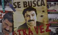 A poster with the face of Mexican drug lord Joaquin "El Chapo" Guzman, reading "Wanted, Again", is displayed at a newsstand in one Mexico City's major bus terminals on July 13, 2015, a day after the government informed of the escape of the drug kingpin from a maximum-security prison. Mexican security forces scrambled Monday to save face and recapture "El Chapo" as authorities investigated whether guards helped him escape prison through a tunnel under his cell.   AFP PHOTO / YURI CORTEZ