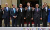 (L to R) US Vice President Mike Pence, Colombia's Foreign Minister Carlos Holmes Trujillo, Guatemalan President Jimmy Morales, Venezuelan opposition leader and self-declared acting president Juan Guaido, Colombian President Ivan Duque and Panama's President Juan Carlos Varela pose for a family picture during the Lima's Group Foreign Affairs Ministers 11th meeting at the Foreign Ministry in Bogota, on February 25, 2019. - US Vice President Mike Pence passed on a message from Donald Trump to Venezuela's opposition leader Juan Guaido on Monday, telling him "we are with you 100 percent." Pence and Guaido met in Colombia's capital during a meeting of regional allies to discuss their next move in response to the crisis in Venezuela. (Photo by Diana Sanchez / AFP)