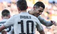Juventus' Portuguese forward Cristiano Ronaldo (R) embraces Juventus' Argentine forward Paulo Dybala after Dybala opened the scoring during the Italian Serie A football match Bologna vs Juventus on February 24, 2019 at the Renato-Dall'Ara stadium in Bologna. (Photo by Tiziana FABI / AFP)