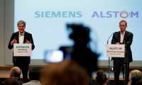 (FILES) In this file photo taken on September 27, 2017 German ICE train manufacturing company Siemens President and CEO, Joe Kaeser (L) and French railway transport company Alstom CEO, Henri Poupart-Lafarge speak during a press conference announcing the union between French railway transport company Alstom and Siemens. - The EU's powerful anti-trust authority on on February 2, 2019 halted a planned merger of the rail businesses of Germany's Siemens and France's Alstom, defying heavy pressure from Paris and Berlin. (Photo by Thomas SAMSON / AFP)