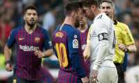 Barcelona's Argentinian forward Lionel Messi (2L) argues with Real Madrid's Spanish defender Sergio Ramos during the Spanish league football match between Real Madrid CF and FC Barcelona at the Santiago Bernabeu stadium in Madrid on March 2, 2019. (Photo by CURTO DE LA TORRE / AFP)