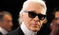 Picture taken on November 20, 2012 shows German fashion designer Karl Lagerfeld during the opening of an exhibition titled "The Little Black Jacket" in Berlin. - German fashion designer Karl Lagerfeld has died at the age of 85, it was announced on February 19, 2019. (Photo by Britta Pedersen / DPA / AFP) / Germany OUT
