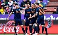 Valencia's Spanish forward Rodrigo Moreno (2R) celebrates  with teammates after scoring during the Spanish League football match between Real Valladolid and Valencia at the Jose Zorrilla stadium in Valladolid on May 18, 2019. (Photo by OSCAR DEL POZO / AFP)