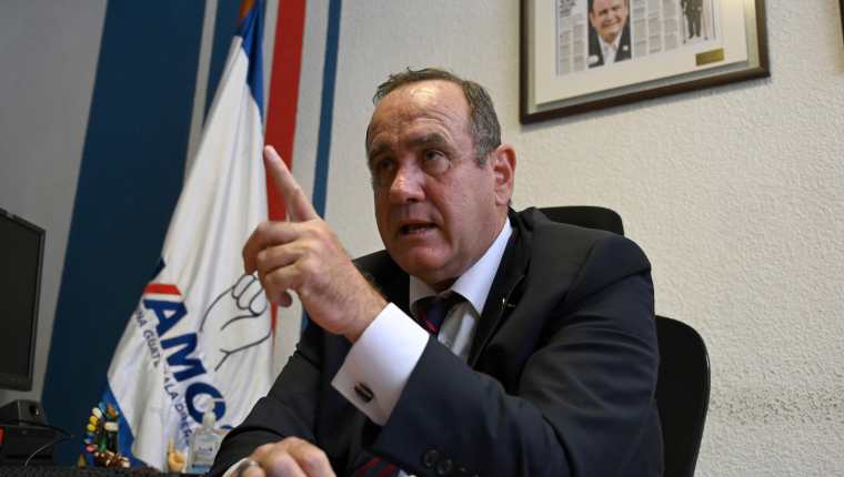 Guatemalan presidential candidate for the Vamos party, Alejandro Giammattei, offers an interview to AFP at his office in Guatemala City, on June 12, 2019, ahead of the June 16 general election. - Right-wing candidate Alejandro Giammattei runs second behind Sandra Torres, a former first lady, in the polls of the presidential election to replace the incumbent Jimmy Morales, but Roberto Arzu, son of late President (1996-2000) Alvaro Arzu, threatens to displace him. A run-off round will be held on August 11 if no candidate reaches a majority in Sunday's vote. (Photo by Johan ORDONEZ / AFP)