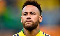 (FILES) In this file photo taken on June 06, 2019 Brazil's Neymar warms up before a friendly football match against Qatar at the Mane Garrincha stadium in Brasilia ahead of Brazil 2019 Copa America. - Neymar is ready to cut his salary by 12 million euros to leave Paris Saint-Germain as part of a "verbal agreement" reached between the Brazilian and Barcelona, according to reports in the Spanish press released on June 25, 2019. (Photo by EVARISTO SA / AFP)
