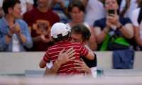 France's Nicolas Mahut hugs his son at the end of his men's singles third round match against Argentina's Leonardo Mayer on day six of The Roland Garros 2019 French Open tennis tournament in Paris on May 31, 2019. (Photo by Kenzo TRIBOUILLARD / AFP)