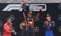 (L-R) Second placed Ferrari's German driver Sebastian Vettel, winner Red Bull's Dutch driver Max Verstappen and third placed Toro Rosso's Russian driver Daniil Kvyat celebrate on the podium after the German Formula One Grand Prix at the Hockenheim racing circuit on July 28, 2019 in Hockenheim, southern Germany. (Photo by Christof STACHE / AFP)