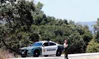 Gilroy (United States), 29/07/2019.- A San Benito County Sheriff guards along a creek near the north side of Christmas Hill Park, where the Gilroy Garlic Festival was held in Gilroy, California, USA, 29 July 2019. A gunman fired upon patrons killing three and injuring 15 people at the popular annual event. Police killed the suspect, and a possible suspect is at large. Santino William Legan has been identified as the 19-year-old suspect from Gilroy. (Incendio, Estados Unidos) EFE/EPA/JOHN G. MABANGLO