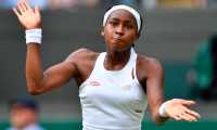 US player Cori Gauff reacts as she plays against Romania's Simona Halep during their women's singles fourth round match on the seventh day of the 2019 Wimbledon Championships at The All England Lawn Tennis Club in Wimbledon, southwest London, on July 8, 2019. (Photo by GLYN KIRK / AFP) / RESTRICTED TO EDITORIAL USE