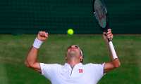 Switzerland's Roger Federer celebrates beating Spain's Rafael Nadal during their men's singles semi-final match on day 11 of the 2019 Wimbledon Championships at The All England Lawn Tennis Club in Wimbledon, southwest London, on July 12, 2019. (Photo by ANDREW COULDRIDGE / POOL / AFP) / RESTRICTED TO EDITORIAL USE