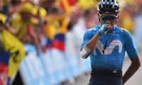 Colombia's Nairo Quintana celebrates as he wins on the finish line of the eighteenth stage of the 106th edition of the Tour de France cycling race between Embrun and Valloire, in Valloire, on July 25, 2019. (Photo by Marco Bertorello / AFP)
