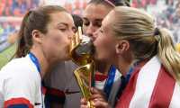 USA's players kiss the trophy after the France 2019 Womens World Cup football final match between USA and the Netherlands, on July 7, 2019, at the Lyon Stadium in Lyon, central-eastern France. (Photo by Philippe DESMAZES / AFP)