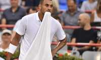 MONTREAL, QC - AUGUST 06: Nick Kyrgios of Australia holds his towel in his mouth against Kyle Edmund of Great Britain during day 5 of the Rogers Cup at IGA Stadium on August 6, 2019 in Montreal, Quebec, Canada.   Minas Panagiotakis/Getty Images/AFP
== FOR NEWSPAPERS, INTERNET, TELCOS & TELEVISION USE ONLY ==