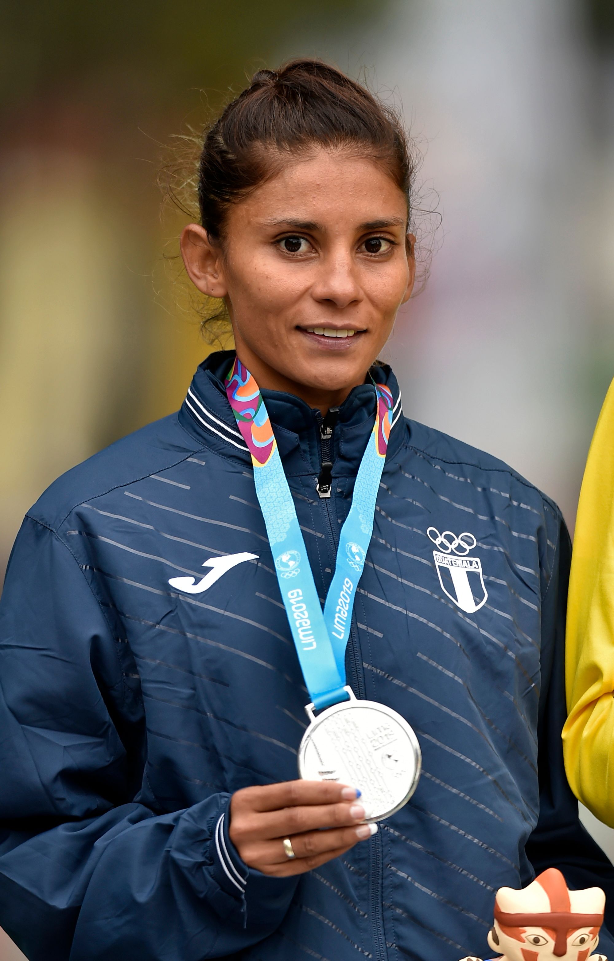 Guatemala's Mirna Ortiz poses in teh podium with ger silver medal after the Women's 50k Walk final during the Lima 2019 Pan-American Games in Lima on August 11, 2019. (Photo by Luis ROBAYO / AFP)