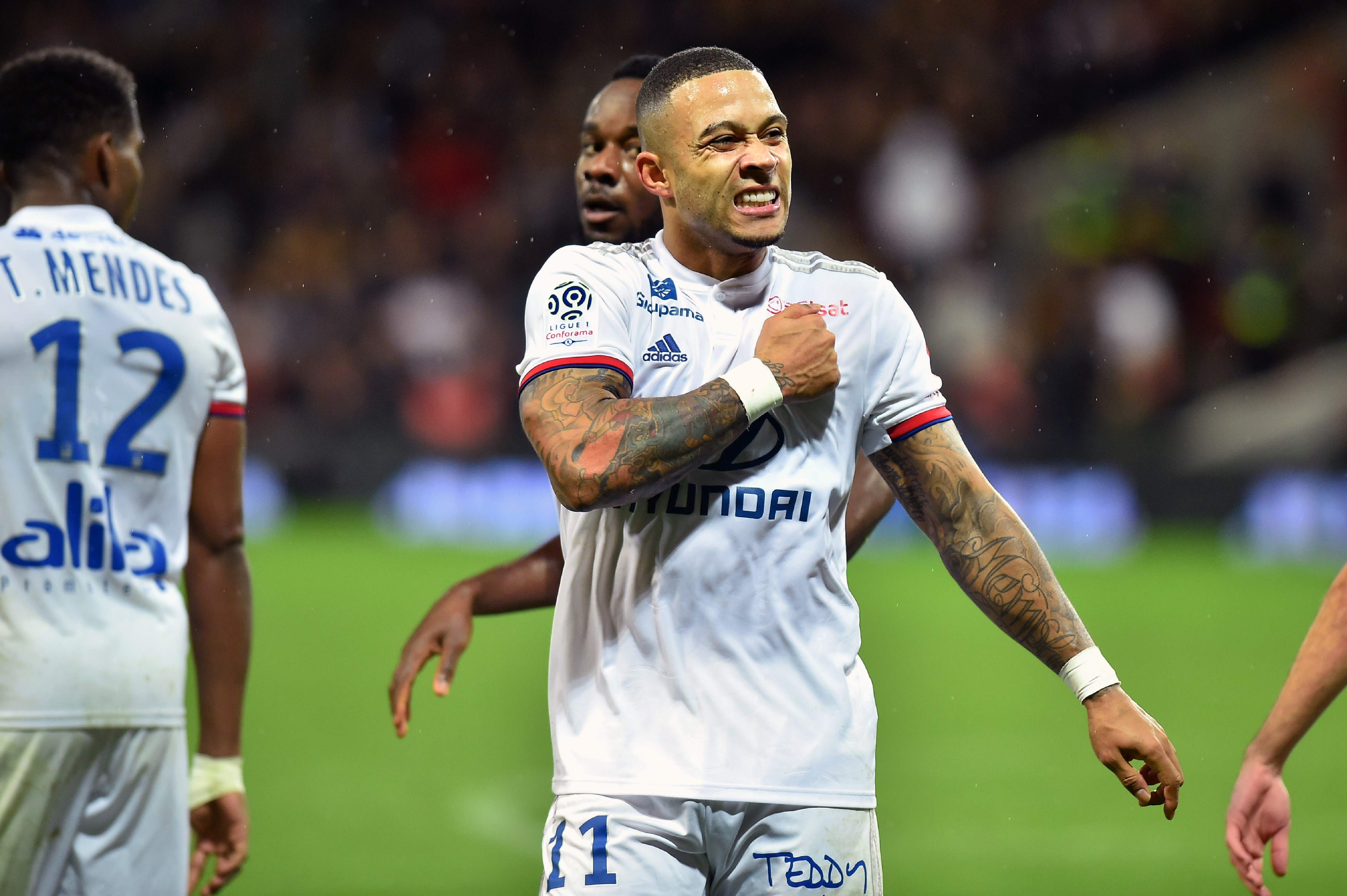 Lyon's forwards Menphis Depay celebrates after scoring a goal during the French L1 football match, Toulouse vs Lyon, on November 2, 2019 at the Municipal stadium in Toulouse southern France. (Photo by REMY GABALDA / AFP)