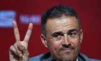 Spain's coach Luis Enrique flashes the Victory sign during a press conference on November 27, 2019 in Madrid during his official presentation. - Luis Enrique returns as coach of Spain and replace Robert Moreno ahead of Euro 2020. Moreno took charge in June after Luis Enrique had resigned to take care of his daughter Xana, who died in August of bone cancer. (Photo by GABRIEL BOUYS / AFP)
