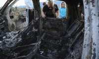 Members of the Lebaron family watch the burned car where part of the nine murdered members of the family were killed and burned during an gunmen ambush on Bavispe, Sonora mountains, Mexico, on November 5, 2019. - US President Donald Trump offered Tuesday to help Mexico "wage war" on its cartels after three women and six children from an American Mormon community were murdered in an area notorious for drug traffickers. (Photo by Herika MARTINEZ / AFP) / The erroneous mention[s] appearing in the metadata of this photo by Herika MARTINEZ has been modified in AFP systems in the following manner: [AFP PHOTO / Herika MARTINEZ ] instead of [AFP PHOTO / STR ]. Please immediately remove the erroneous mention[s] from all your online services and delete it (them) from your servers. If you have been authorized by AFP to distribute it (them) to third parties, please ensure that the same actions are carried out by them. Failure to promptly comply with these instructions will entail liability on your part for any continued or post notification usage. Therefore we thank you very much for all your attention and prompt action. We are sorry for the inconvenience this notification may cause and remain at your disposal for any further information you may require.
