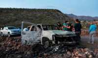 CORRECTION - Members of the Lebaron family watch the burned car where part of the nine murdered members of the family were killed and burned during an gunmen ambush on Bavispe, Sonora mountains, Mexico, on November 5, 2019. - US President Donald Trump offered Tuesday to help Mexico "wage war" on its cartels after three women and six children from an American Mormon community were murdered in an area notorious for drug traffickers. (Photo by Herika MARTINEZ / AFP) / The erroneous mention[s] appearing in the metadata of this photo by Herika MARTINEZ has been modified in AFP systems in the following manner: [AFP PHOTO / Herika MARTINEZ ] instead of [AFP PHOTO / STR ]. Please immediately remove the erroneous mention[s] from all your online services and delete it (them) from your servers. If you have been authorized by AFP to distribute it (them) to third parties, please ensure that the same actions are carried out by them. Failure to promptly comply with these instructions will entail liability on your part for any continued or post notification usage. Therefore we thank you very much for all your attention and prompt action. We are sorry for the inconvenience this notification may cause and remain at your disposal for any further information you may require.