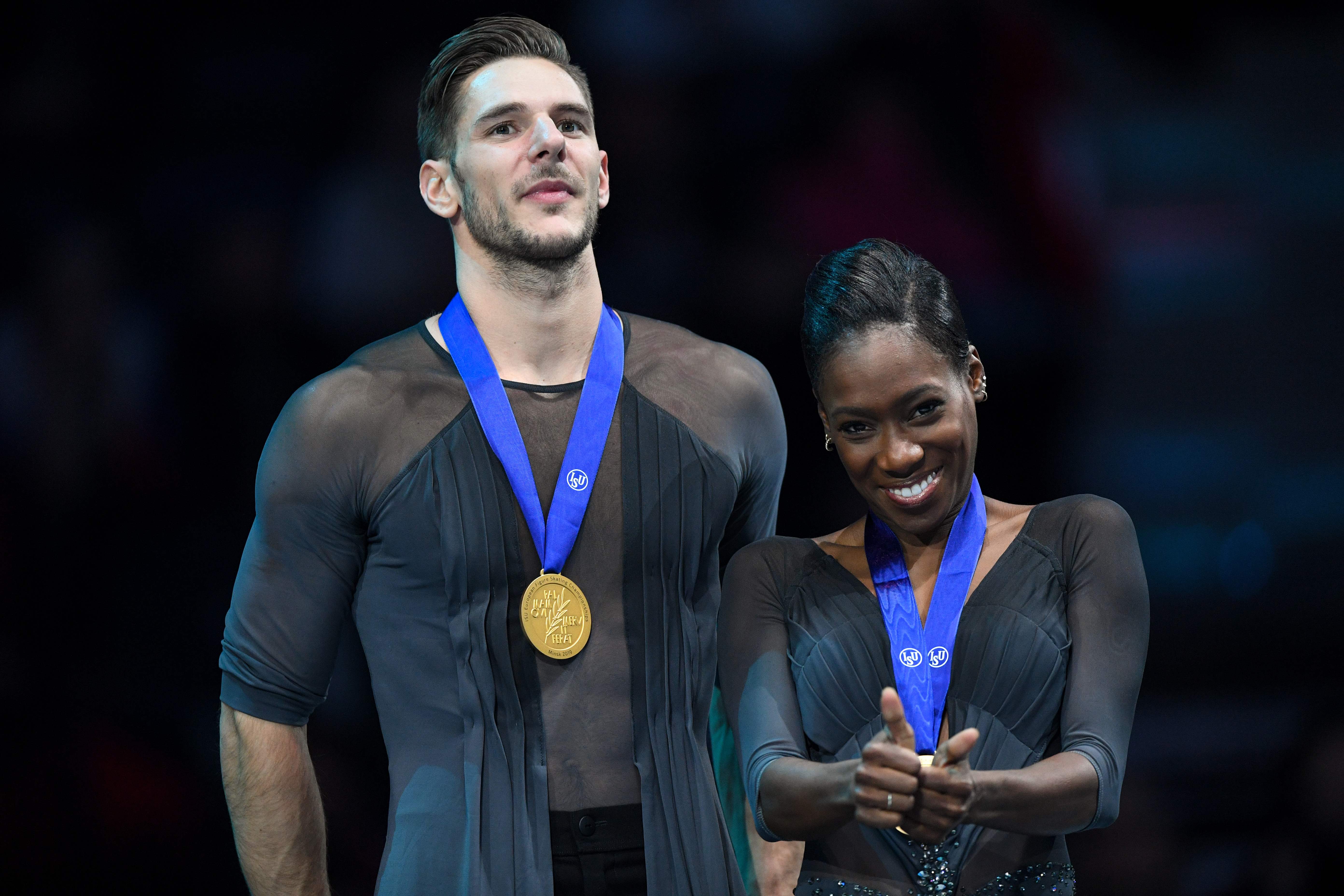 (FILES) In this file photo taken on January 24, 2019 winners Frances Vanessa James and Morgan Cipres celebrate with their gold medals during the podium ceremony after the pairs' free skating event at the ISU European Figure Skating Championships in Minsk. - French figure skater Morgan Cipres is under investigation by the United States Center for SafeSport after allegedly sending lewd photographs to a 13-year-old girl, USA Today reported on December 10, 2019. Cipres, a two-time Olympian and pairs bronze medallist at the 2018 World Championship with partner Vanessa James, is alleged to have sent two photos of his penis to the girl, who skated at the same Florida rink as the Frenchman. (Photo by Kirill KUDRYAVTSEV / AFP)