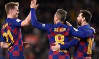 Barcelona's Brazilian midfielder Arthur celebrates scoring his team's fourth goal with Barcelona's Dutch midfielder Frenkie De Jong (L) and Barcelona's Argentine forward Lionel Messi during the Copa del Rey (King's Cup) football match between FC Barcelona and Club Deportivo Leganes SAD at the Camp Nou stadium in Barcelona, on January 30, 2020. (Photo by Josep LAGO / AFP)