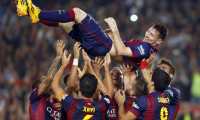 epa08095864 PICTURES OF THE DECADE 

FC Barcelona's Argentinian striker Lionel Messi (up) is tossed in the air by his teammates after he marked his 253rd goal in La Liga, breaking the league's top scoring record, during the Spanish Primera Division soccer match between FC Barcelona and Sevilla FC at Camp Nou in Barcelona, north-eastern Spain, 22 November 2014. EPA/ANDREU DALMAU *** Local Caption *** 51688783