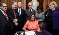 Washington (United States), 15/01/2020.- Speaker of the House Nancy Pelosi, with committee chairs and House impeachment managers, signs the articles of impeachment during an engrossment ceremony prior to them being walked across the Capitol to the Senate in the US Capitol in Washington, DC, USA, 15 January 2020. Senate Majority Leader Mitch McConnell said the Senate trial against US President Donald J. Trump, on the charges of abuse of power and obstruction of Congress, will begin on 21 January. (Estados Unidos) EFE/EPA/SHAWN THEW