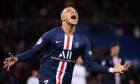 Paris Saint-Germain's French forward Kylian Mbappe celebrates after scoring a goal during the French L1 football match between Paris Saint-Germain (PSG) and Dijon, on February 29, 2020 at the Parc des Princes stadium in Paris. (Photo by FRANCK FIFE / AFP)