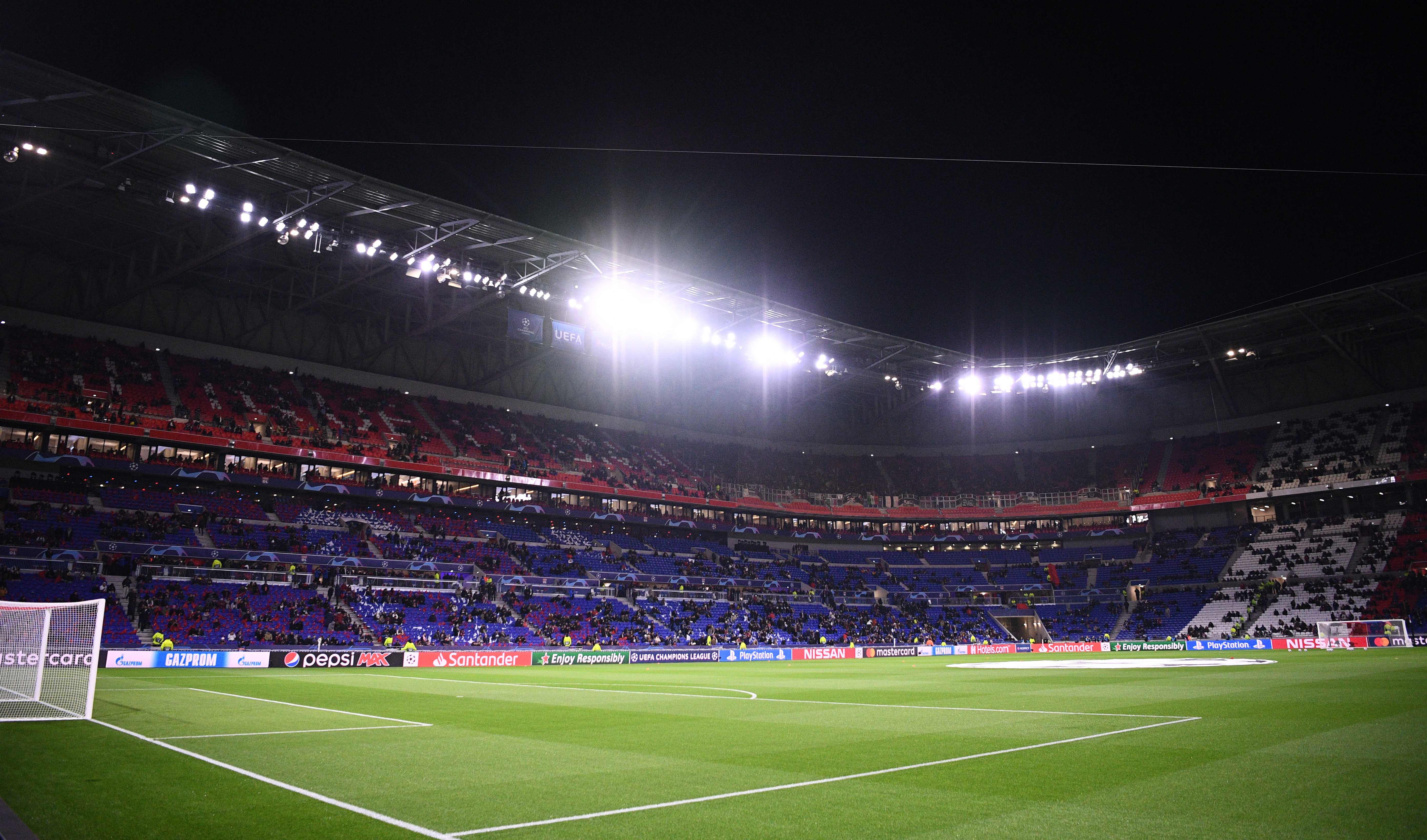 This picture taken on February 26, 2020 shows the Parc Olympique Lyonnais stadium in Decines-Charpieu prior the UEFA Champions League round of 16 first-leg football match between Lyon and Juventus, on February 26, 2020. (Photo by FRANCK FIFE / AFP)