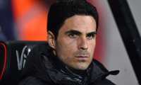 (FILES) In this file photo taken on January 27, 2020 Arsenal's Spanish head coach Mikel Arteta awaits kick off in the English FA Cup fourth round football match  between Bournemouth and Arsenal at the Vitality Stadium in Bournemouth, southern England. - Arsenal manager Mikel Arteta has tested positive for the coronavirus, the Premier League club announced on March 12, 2020. "Our London Colney training centre has been closed after head coach Mikel Arteta received a positive Covid-19 result this evening," the Arsenal statement read. (Photo by Glyn KIRK / AFP) / RESTRICTED TO EDITORIAL USE. No use with unauthorized audio, video, data, fixture lists, club/league logos or 'live' services. Online in-match use limited to 120 images. An additional 40 images may be used in extra time. No video emulation. Social media in-match use limited to 120 images. An additional 40 images may be used in extra time. No use in betting publications, games or single club/league/player publications. /