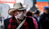 A man wears a face mask to prevent from contacting the new coronavirus in Tijuana, Baja California state, Mexico, on March 17, 2020. - While in Mexico strong measures have not taken place yet, many countries across the world had implemented a quarantine to fight the spread of the novel coronavirus by closing schools, shops and borders, among other measures. (Photo by Guillermo Arias / AFP)